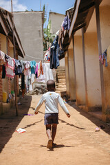 boy running in Uganda, Africa