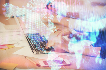 Multi exposure of woman hands typing on computer and financial chart hologram drawing. Stock market analysis concept.