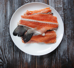 raw salmon pieces on a plate