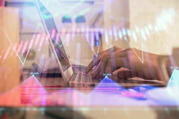 Double exposure of woman hands typing on computer and forex chart hologram drawing. Stock market invest concept.