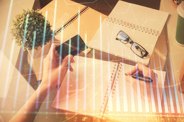 Fototapeta na wymiar Multi exposure of woman on-line shopping holding a credit card and financial graph drawing. Stock market E-commerce concept.