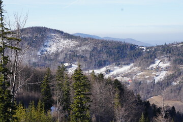 view of winter and white landscape from the observation platform at peak of mountain in Szczyrk, Skrzyczne localization Beskid Mountains. Screensaver, copyspace or natural background.