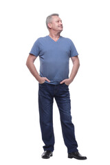Smiling middle aged man standing with his hands in pockets