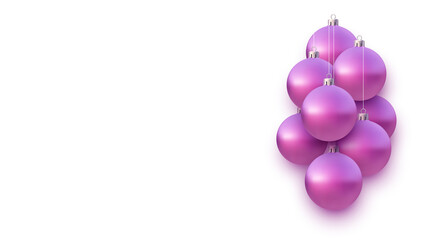 Background with pink christmas tree balls hanging on strings.