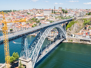 PORTO, PORTUGAL - JUNE 11, 2019: Luis I bridge and Douro river. It is the second-largest city in Portugal. It was proclaimed a World Heritage Site by UNESCO in 1996.