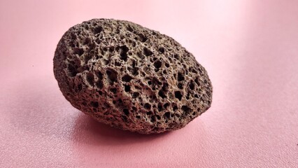 Oxide pumice speciment, brown, rounded and weighs light , is a volcanic rock that consists of highly vesicular rough textured volcanic glass, which may or may not contain crystals. Central Java