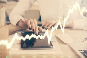 Double exposure of forex chart sketch hologram and woman holding and using a mobile device. Financial market concept.