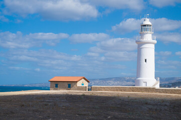Fototapeta na wymiar White lighthouse in Paphos, Cyprus