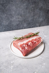 Food preparation raw meat ham beef lamb with rosemary. the butcher shop showcase. lunch or dinner new year Christmas Holiday,  food top view