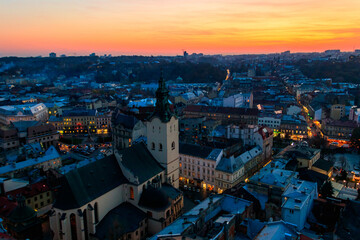 Fototapeta na wymiar Aerial view of Latin cathedral and Rynok square in Lviv, Ukraine at sunset. View from Lviv town hall