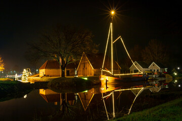 Complete restored lime kiln at night in the December month with a decoration of Christmas lights in...