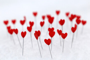 Red hearts on a snow. Background for romantic love, greeting card, Valentine's day