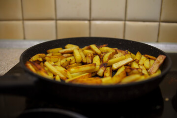 Fried potatoes in a black skillet