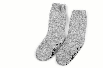 Gray warm knitted wool socks handmade pair for cold winter, isolated