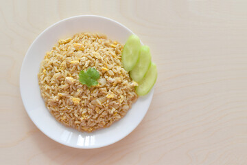 Egg fried rice on a white plate. 