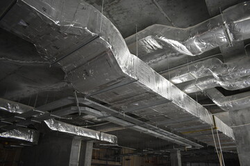 MEP works in civil construction site. Aluminum fabricated air flow duct and steel tray supporting...