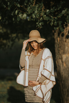Beautiful pregnant girl with cowboy hat