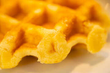 waffle is on a white plate.