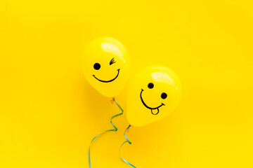 Happiness emotions painted on ballon. Positive mood background. Top view