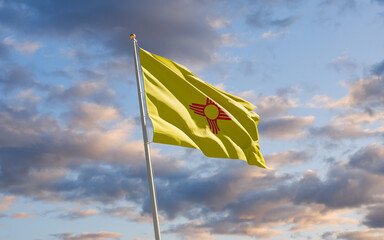 New Mexico US State Flag at sky background.