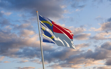 North Carolina US State Flag at sky background.