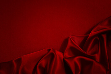 Black red silk satin background. Copy space for text or product. Wavy soft folds on shiny fabric....