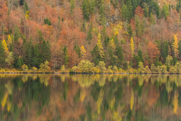 colorful idyllic autumn mood on a mountain lake