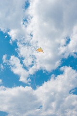 Fototapeta na wymiar kite flying in the sky with white clouds