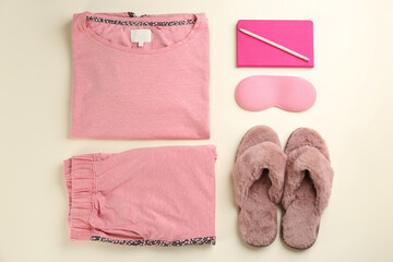 Flat lay composition with house slippers, sleeping mask and pajamas on light background