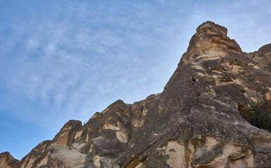 Fototapeta premium Ancient cave houses and rock formations near Goreme, Cappadocia, Turkey