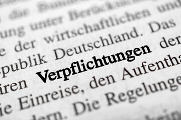 Verpflichtungen is the german word of commitments - black and white image