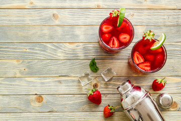 Fresh strawberry cocktail drink with ice, top view