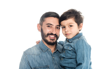 Hispanic man smiling at camera near grandson isolated on white, two generations of men