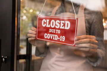 Woman putting red sign with words 