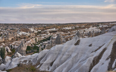Ancient cave houses  and rock formations near Goreme, Cappadocia, Turkey