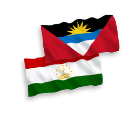 National vector fabric wave flags of Tajikistan and Antigua and Barbuda isolated on white background. 1 to 2 proportion.