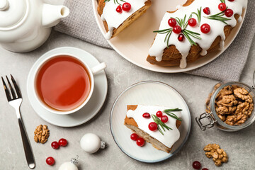 Flat lay composition with traditional homemade Christmas cake on light grey table