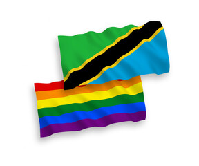 National vector fabric wave flags of Rainbow gay pride and Tanzania isolated on white background. 1 to 2 proportion.