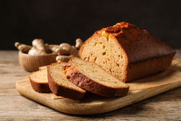 Sliced delicious gingerbread cake on wooden table