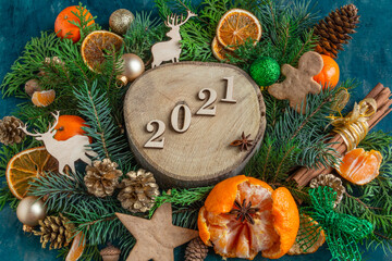  Christmas and New Year compositions on a on a green background, tangerines, oranges, gingerbread. Copy space, flat lay