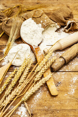 Flour in sacks, ears of grain, spoons and wooden rolling pins