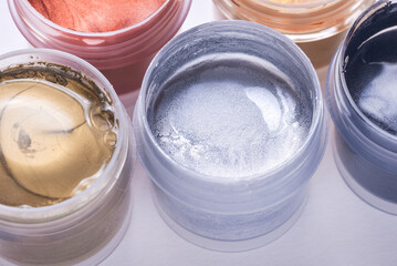 Set of different glitter paint in can