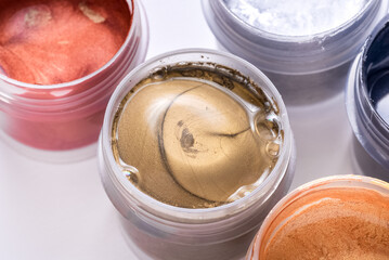 Set of different glitter paint in can