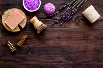 Flat lay of lavender cosmetics - bath salt and essential oil, top view