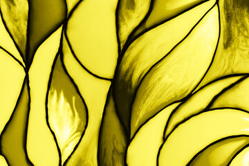 Photo of a small fragment of a beautiful stained glass toned in trendy yellow color. Mockup for your design. Trendy background. Color 2021 concept.