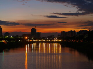 Bridge with lights at dawn