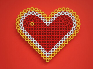Red-yellow-white heart made from mosaic on red paper background