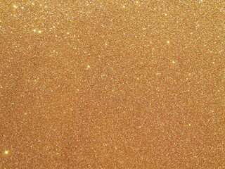 Defocused background of abstract gold glitter lights 
