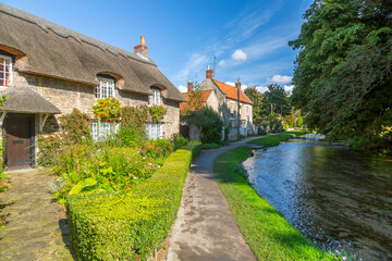View of riverside cottages and Thornton Beck, Thornton Dale, North Yorkshire, England