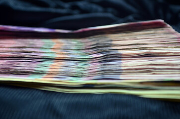 Large amount of money. Currency of Ukraine. Stack. Finance. Stocks, credit, debt.